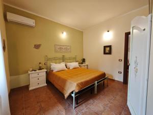 Postel nebo postele na pokoji v ubytování B&B Domu Delunas