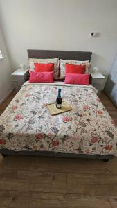 a bedroom with a large bed with a table on it at Modern Flat near Central London! in London