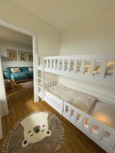 En eller flere senge i et værelse på Apartment Wolfswarte, Panorama, Sauna, Schwimmbad + 24 billeder