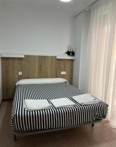 a large bed in a room with at Apartamento CA VALEN 6 in Peniscola