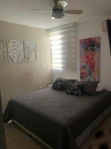 Un pat sau paturi într-o cameră la Tu Apartamento ideal