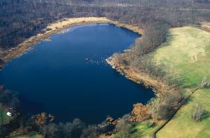 an aerial view of a large blue lake at L'antica stanza in Arona