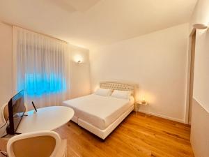 Postel nebo postele na pokoji v ubytování Hotel Pex Mantova