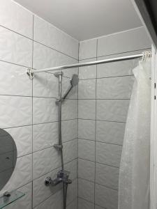 a shower in a bathroom with a shower curtain at Studio au cœur de Montmartre in Paris