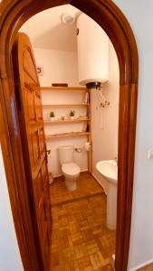 a bathroom with a toilet and a sink at apparemment 3 ème étage à-côtés de la plage in Essaouira +4 photos