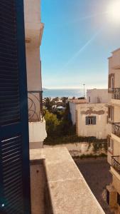 a view of the ocean from a balcony of a building at apparemment 3 ème étage à-côtés de la plage in Essaouira