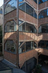 an external view of a brick building with windows at Sloth Loft Montmartre 2025 Refresh in Paris