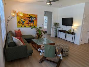 a living room with a couch and a table at 3Bedroom, 2 Bathroom Condo in gated community in Fort Myers
