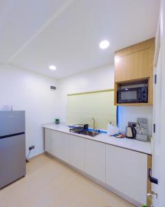 Kuchyň nebo kuchyňský kout v ubytování Yellow Door Hotels