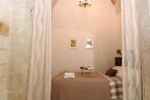 Ένα ή περισσότερα κρεβάτια σε δωμάτιο στο Moire Apulian Apartment