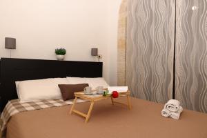 Ένα ή περισσότερα κρεβάτια σε δωμάτιο στο Moire Apulian Apartment