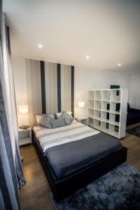 a bedroom with a large bed in a room at Casa Mãe Deus - House Azores in Ponta Delgada