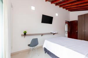 Телевизор и/или развлекательный центр в Acogedor apartamento en Medellín