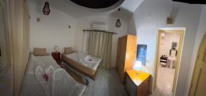Letto o letti in una camera di Dahab Lodge