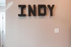 een bord op een muur boven een deur bij Adorable Broad Ripple Duplex in Indianapolis