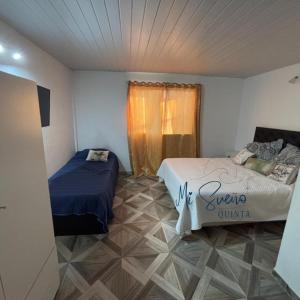 Ένα ή περισσότερα κρεβάτια σε δωμάτιο στο Hospedaje en Monte Grande +52 φωτογραφίες