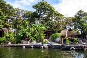 a resort with a body of water and a building at Jicaro Island Lodge Member of the Cayuga Collection in Isletas de Granada