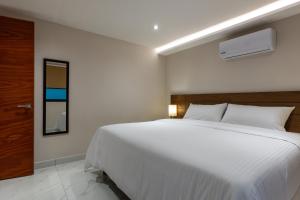 Postel nebo postele na pokoji v ubytování Hotel 28 Cancun