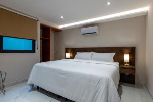 Postel nebo postele na pokoji v ubytování Hotel 28 Cancun
