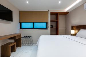 Postel nebo postele na pokoji v ubytování Hotel 28 Cancun + 37 fotografií