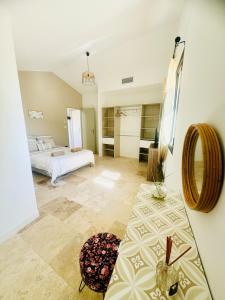 a bedroom with two beds in a room at Les Rives du Parc Piscine 12 personnes in Lédenon