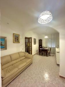 a living room with a couch and a table at Casa Mariarosa Tuscany in Gragnana