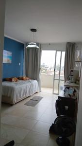 Katil atau katil-katil dalam bilik di Apartamento Com Vista para o Mar