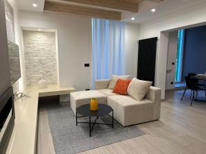a living room with a couch and a table at Dream Suite Mare Giovinazzo in Giovinazzo +32 photos