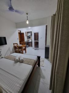 Katil atau katil-katil dalam bilik di Harmony Apartments +18 gambar