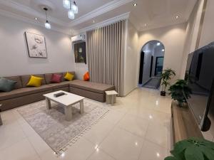 a living room with a couch and a table at مساكن اهلا وسهلا in Taif