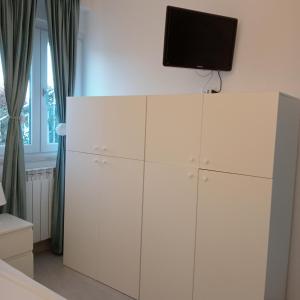 TV a/nebo společenská místnost v ubytování Casa vacanze Arcobaleno