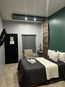 Postel nebo postele na pokoji v ubytování Hotel Diaz