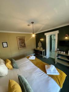 The Cambridge Guest House by Tas客房内的一张或多张床位
