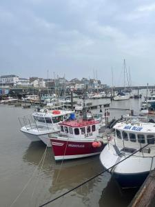 a group of boats are docked in a harbor at Winston House Guesthouse in Bridlington