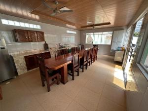 a large kitchen with a wooden table and chairs at Casa do Pomar in Alter do Chao