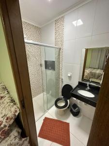 a bathroom with a toilet and a sink and a mirror at Casa do Pomar in Alter do Chao +10 photos