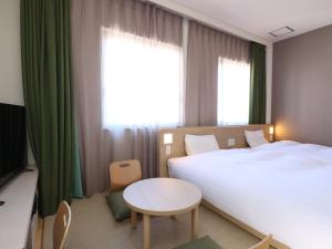 Cama ou camas em um quarto em Dormy Inn Kofu Natural Hot Spring Kaiji no Yu Reopening on February 3rd 2025