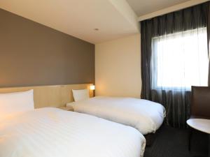 Cama ou camas em um quarto em Dormy Inn Kofu Natural Hot Spring Kaiji no Yu Reopening on February 3rd 2025