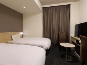Cama ou camas em um quarto em Dormy Inn Kofu Natural Hot Spring Kaiji no Yu Reopening on February 3rd 2025