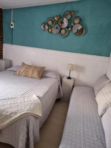 En eller flere senge i et værelse på Las casitas de Alva