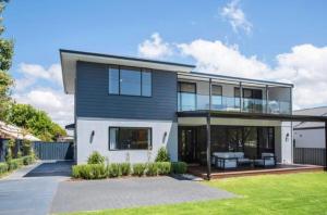 a large house with a lot of windows at Huge Luxury Busselton Jetty in Busselton