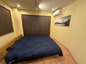 Postel nebo postele na pokoji v ubytování 金春in KONPAL