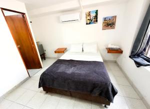 Postel nebo postele na pokoji v ubytování Hotel CasaBlanca Cartagena