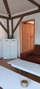 a living room with a couch and a table at Fewo am grossen Bruch 2 in Oschersleben