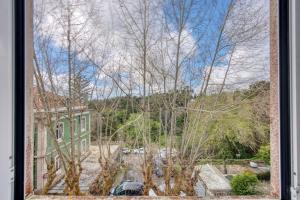 a view from a window of a house and trees at Monte da Lua in Sintra