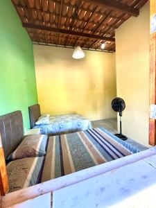 Giường trong phòng chung tại Oásis morro branco casa de praia