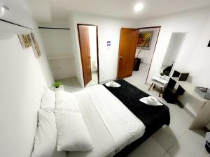 Postel nebo postele na pokoji v ubytování Hotel CasaBlanca Cartagena