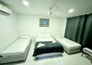 Postel nebo postele na pokoji v ubytování Hotel CasaBlanca Cartagena