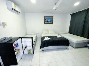 Postel nebo postele na pokoji v ubytování Hotel CasaBlanca Cartagena