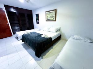 Postel nebo postele na pokoji v ubytování Hotel CasaBlanca Cartagena